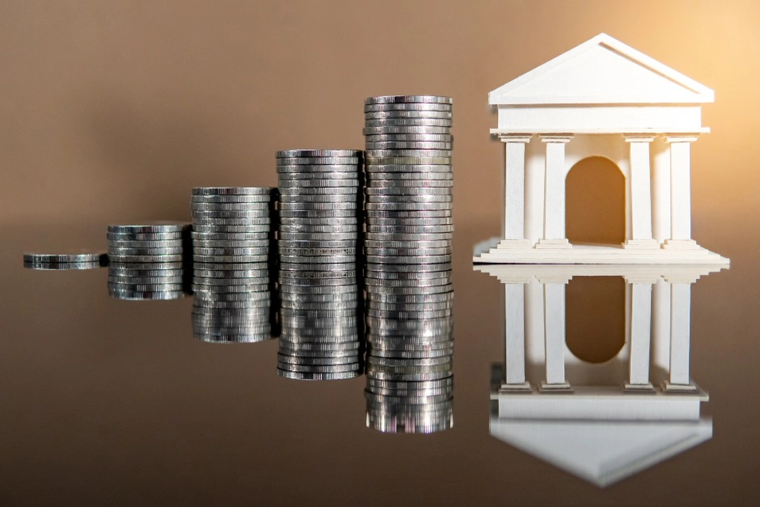 Choy Consulting UG – Finanzberater – Münzen und Haus
